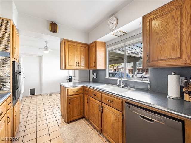 kitchen with stainless steel dishwasher, ceiling fan, sink, oven, and light tile patterned flooring