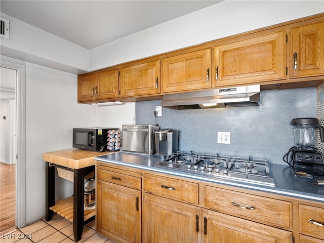 kitchen featuring light hardwood / wood-style flooring and appliances with stainless steel finishes