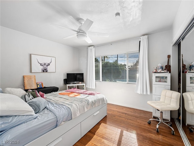 bedroom with hardwood / wood-style floors and ceiling fan