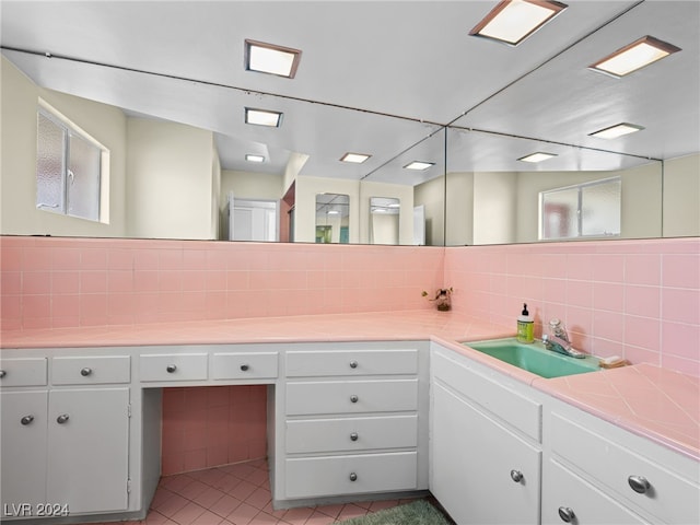 bathroom featuring vanity, tasteful backsplash, and tile patterned floors