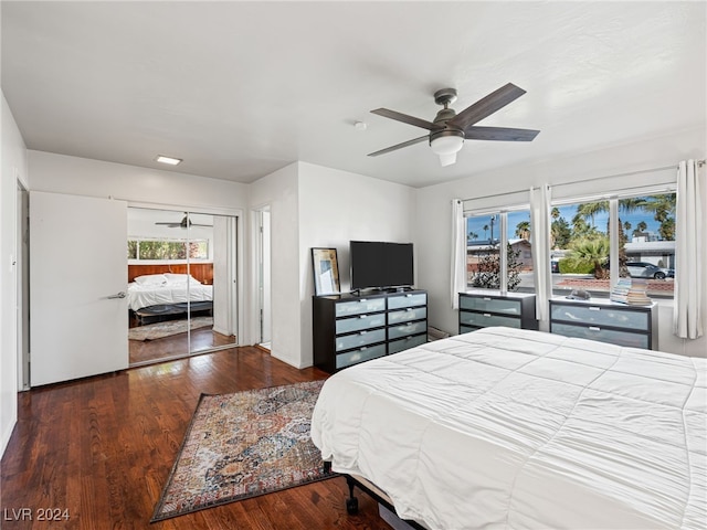 bedroom featuring dark hardwood / wood-style flooring, a closet, and ceiling fan