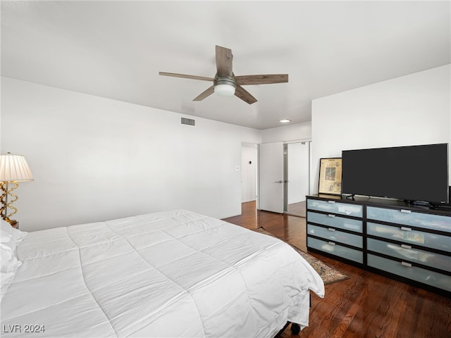 bedroom featuring hardwood / wood-style floors and ceiling fan