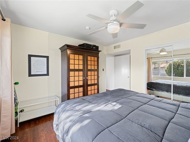 bedroom featuring ceiling fan, dark hardwood / wood-style flooring, and french doors