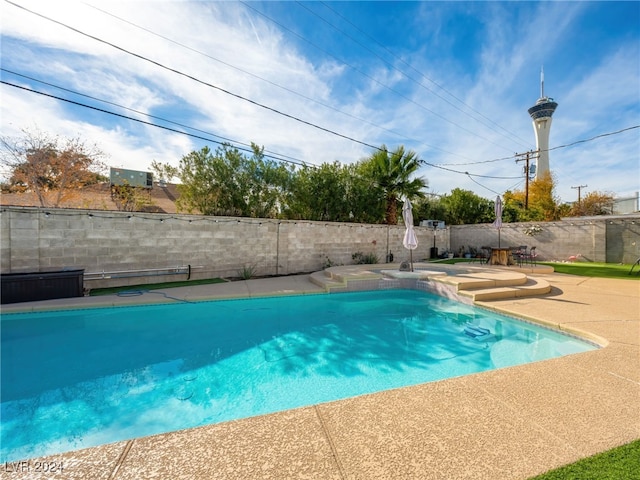 view of swimming pool with a patio area