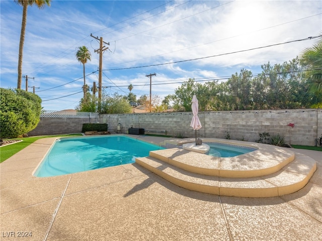 view of swimming pool with a patio area