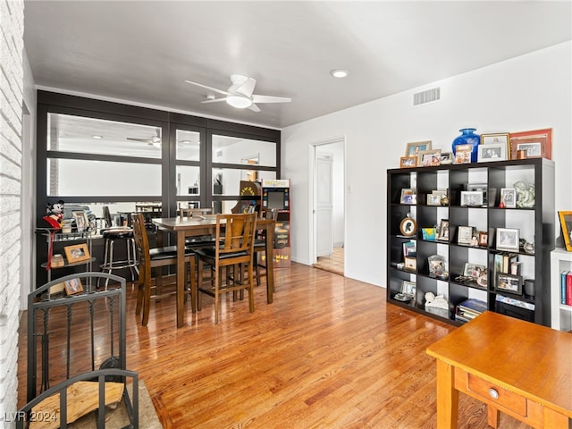 dining space featuring light hardwood / wood-style flooring and ceiling fan