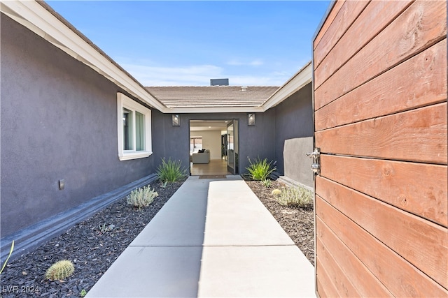 property entrance with a patio area