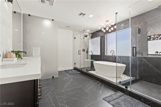 bathroom with vanity, separate shower and tub, tile walls, and a notable chandelier