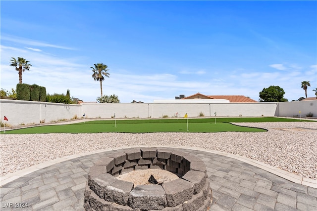 view of patio with a fire pit