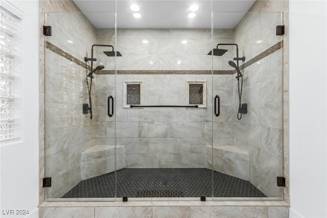 bathroom featuring an enclosed shower