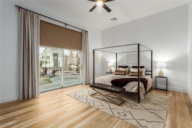 bedroom featuring ceiling fan, wood-type flooring, and access to exterior