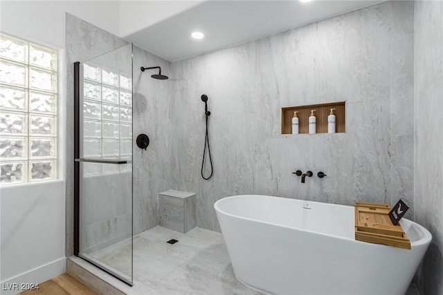 bathroom with separate shower and tub