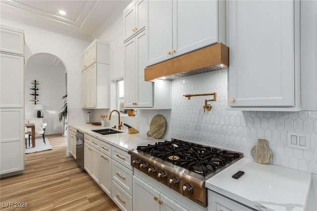 kitchen featuring white cabinets, appliances with stainless steel finishes, and sink