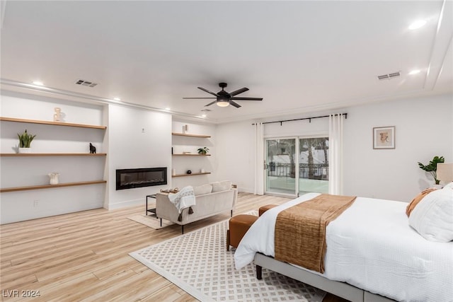 bedroom with light hardwood / wood-style floors, ceiling fan, and access to outside