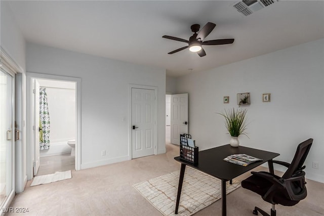 office space with ceiling fan and light colored carpet