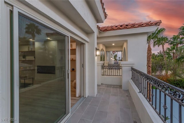 view of balcony at dusk