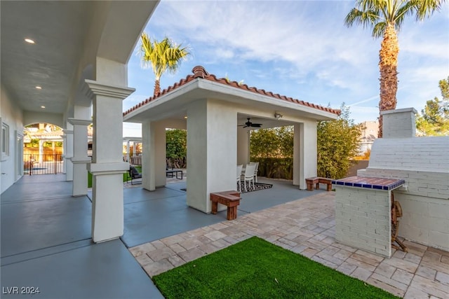 view of patio / terrace featuring ceiling fan