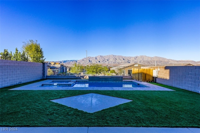 exterior space featuring a mountain view and a swimming pool with hot tub