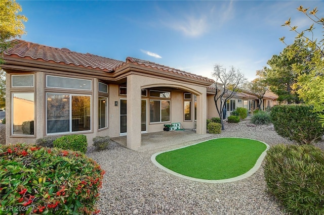 back of house featuring a patio