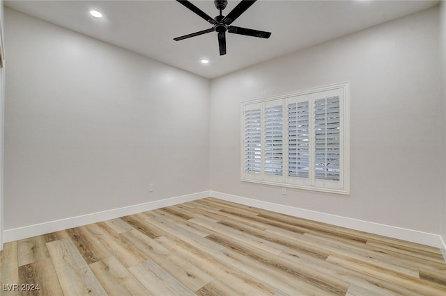 unfurnished room featuring light hardwood / wood-style flooring and ceiling fan