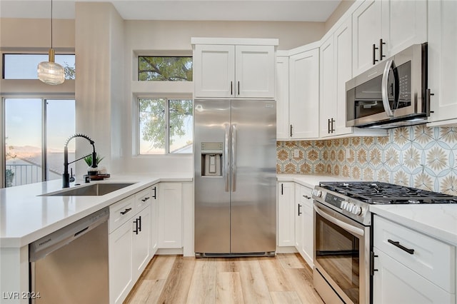 kitchen featuring sink, white cabinetry, and stainless steel appliances