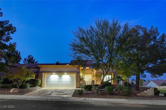 view of front of property with a garage