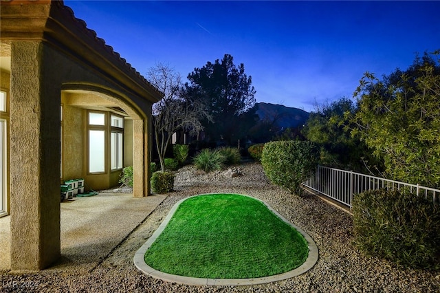 view of yard with a mountain view and a patio area