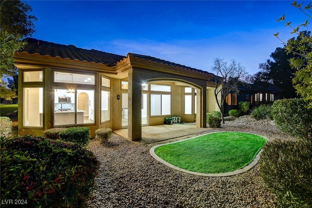 rear view of house featuring a patio area