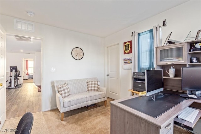 home office featuring carpet and visible vents
