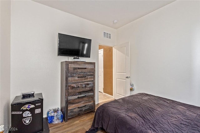 bedroom with light wood-type flooring