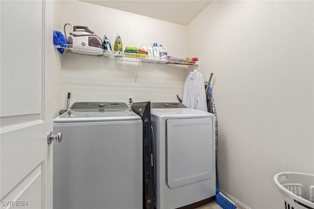 clothes washing area featuring washing machine and clothes dryer