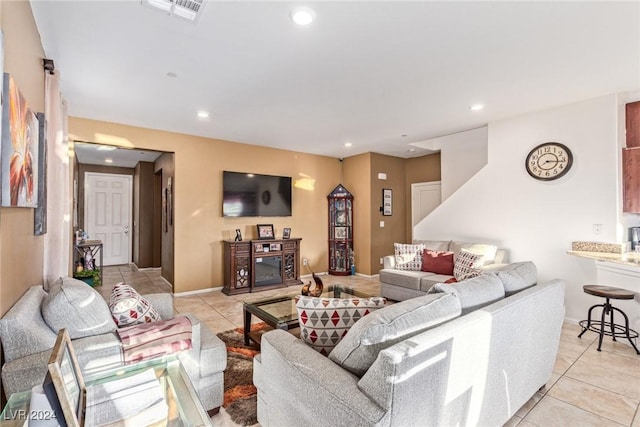 tiled living room with a fireplace