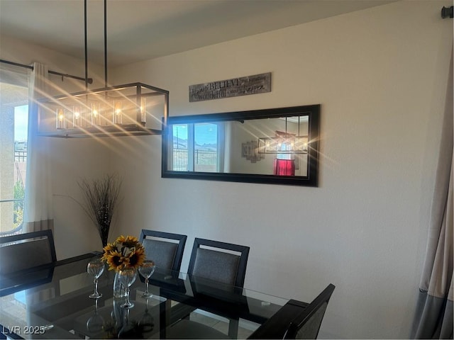 dining room featuring a chandelier