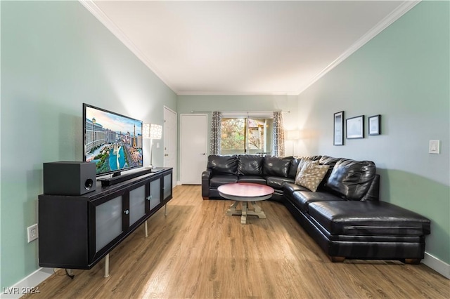 living room with light hardwood / wood-style floors and ornamental molding