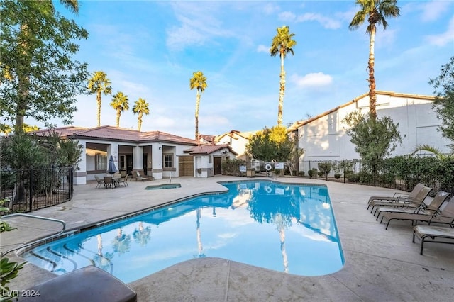 view of swimming pool featuring a patio area