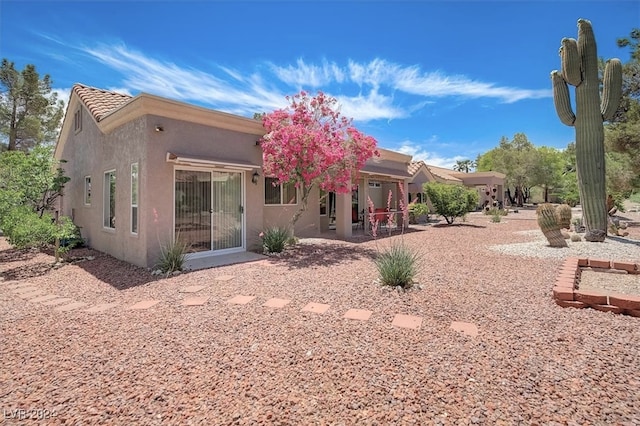 back of property with a patio area