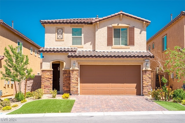 mediterranean / spanish-style house featuring a garage