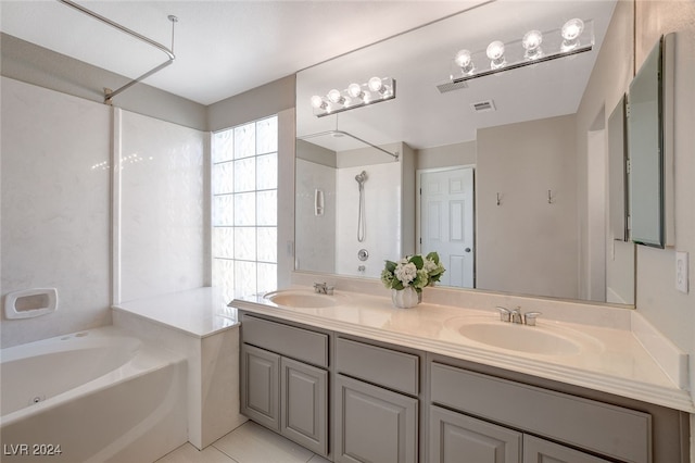 bathroom with tile patterned floors, vanity, and plus walk in shower