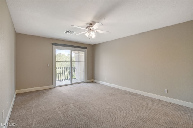 empty room with light carpet and ceiling fan