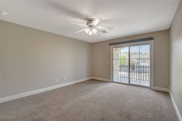 carpeted empty room with ceiling fan