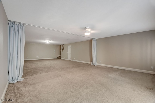 basement with light colored carpet