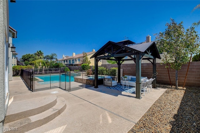 view of swimming pool featuring outdoor lounge area, a gazebo, and a patio