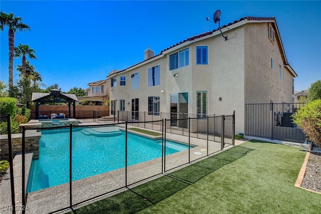 view of swimming pool featuring an in ground hot tub, a gazebo, and a patio area