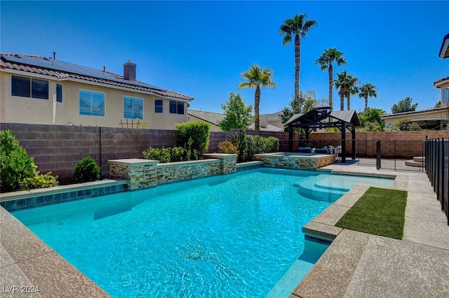 view of pool featuring an in ground hot tub and a gazebo