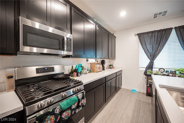 kitchen featuring light hardwood / wood-style floors, sink, and stainless steel appliances