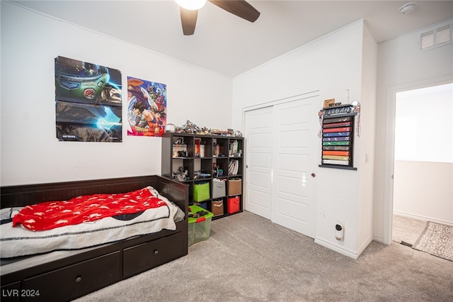 bedroom with light carpet, a closet, and ceiling fan