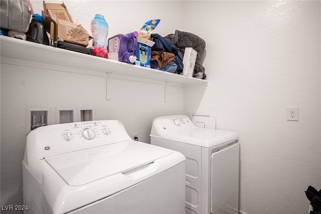 laundry room featuring washing machine and clothes dryer