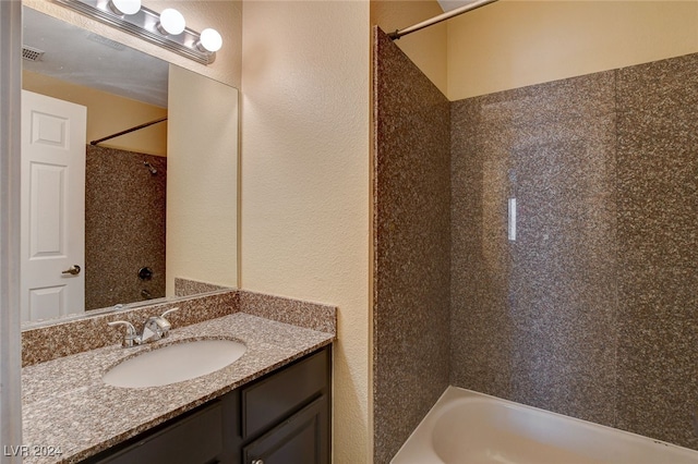 bathroom featuring bathtub / shower combination, visible vents, and vanity