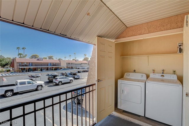 laundry area featuring a healthy amount of sunlight, laundry area, and washing machine and clothes dryer