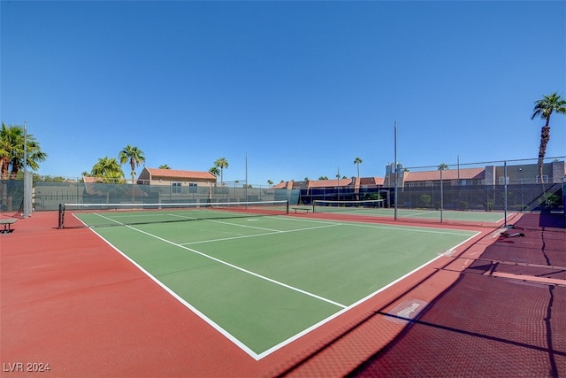 view of sport court featuring community basketball court and fence